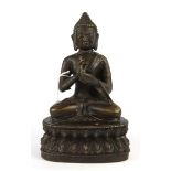 A Chinese bronze figure of the seated Buddha, H. 20cm.