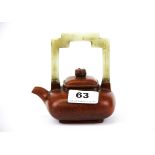 A Chinese terracotta teapot with carved jade handle, H. 12cm.