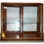 A wood and glass counter top display cabinet, size 58 x 52 x 20cm.