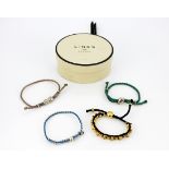 Four Links bracelets in a Links box.