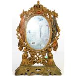 An ornate gilt and painted metal military dressing table mirror, H. 55cm.