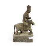 A rare Chinese Qing dynasty carved wooden figure of a deity riding a horse with a prayer cavity in