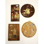 Four Oriental wooden panels inlaid with carved semi precious stones.