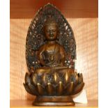 A Chinese bronze figure of the Buddha seated on a lotus flower base, H. 22cm.