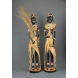 Two carved wooden African Tribal figures, H. 62cm.