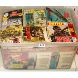 A large box of vintage war comics.