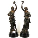 A pair of bronzed spelter muse figures on wooden plinths, H. 44cm.