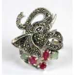 A 925 silver and marcasite elephant shaped ring set with rubies and emeralds, (N).