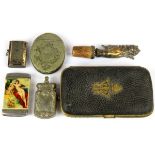 A cigar case, three vesta cases, a snuff box and a wine bottle stopper.