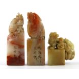 Three Chinese carved soapstone scholars seals, tallest 8.5cm.