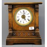A 1912 Fattorini & Sons oak mantle clock, H. 32cm.