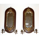 Two Victorian wall mounted wooden framed mirrors with gilt brass candle sconces, L. 45cm.