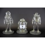 Three glass models of two divers and a World War II mine, scuba diver H. 14cm.