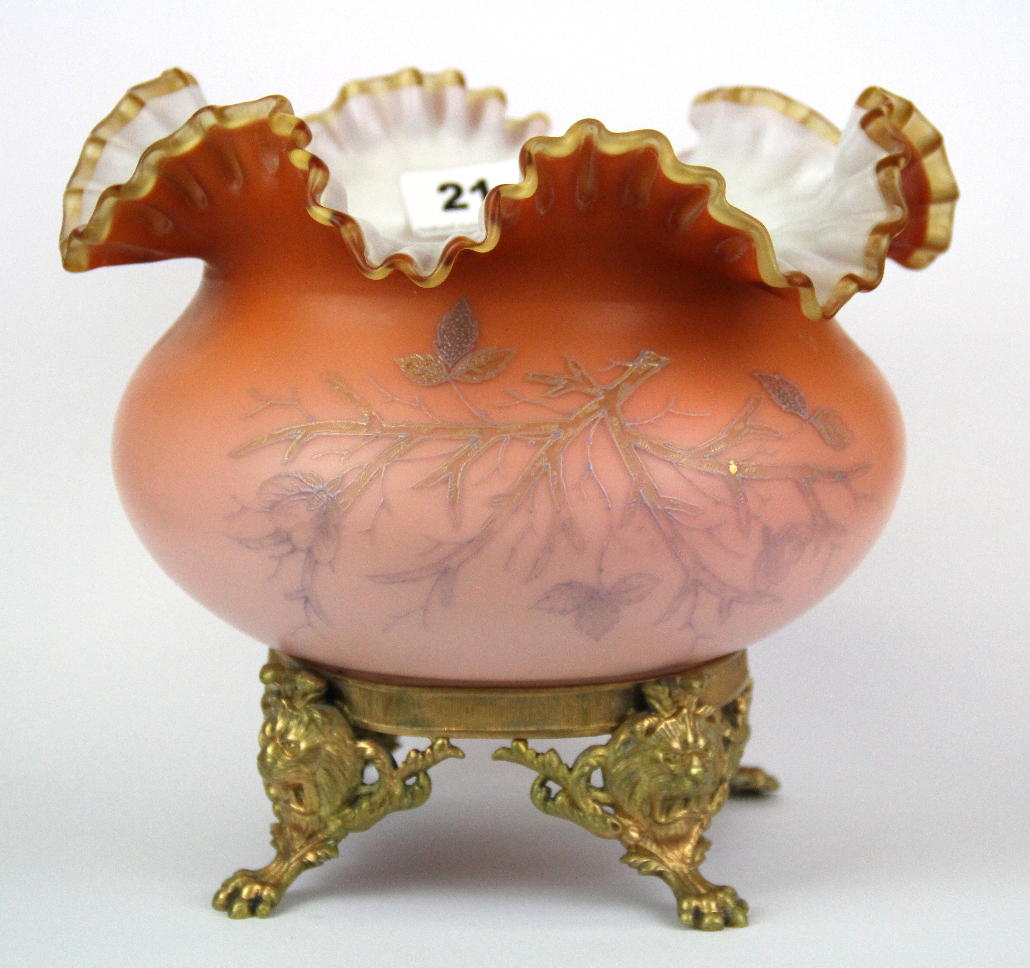 A Victorian opaline glass bowl mounted on a gilt bronze stand with lion's paw feet, H. 20m.