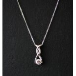 A boxed 9ct white gold stone set pendant and chain, L. 48cm.