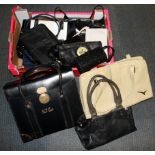 A quantity of vintage handbags.