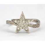 An 18ct white gold star shaped crossover ring set with brilliant cut diamonds, (N).