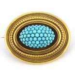 A boxed Victorian yellow metal (tested 18ct gold) turquoise set brooch, in an antique brooch box,
