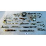 A collection of car badges, to include: Humber, Rover 90, Austin, Rover 105R, Riley,