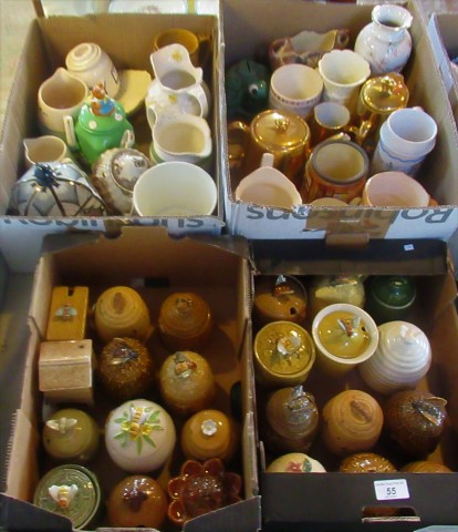 Two boxes containing a quantity of honey jars and pots, various designs,