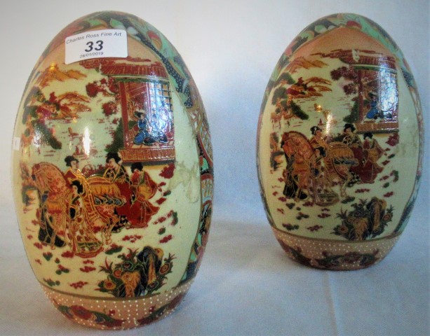 A pair of table ornaments of ovoid form, decorated in the Oriental manner.