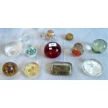 A collection of various colour glass paperweights (12).