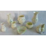A collection of Belleek china, to include: twin handled tall neck vase, cream jug, sugar bowl,