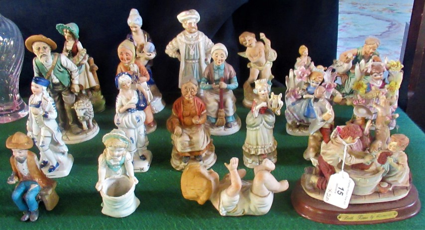 A collection of miscellaneous Continental figurines, to include: Lady on a swing with her Beau,