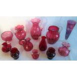 A collection of cranberry glass, to include: large single handled glass, lemonade jug,