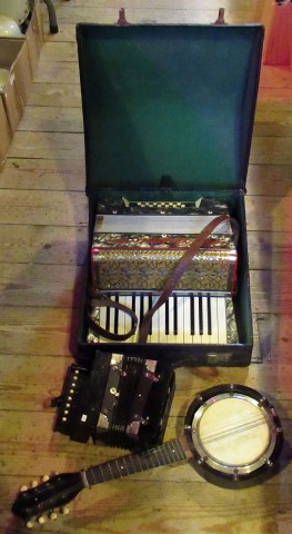 A cased accordion by Vissimio, together with a smaller accordion and a banjolele.