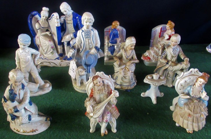 A collection of miscellaneous Continental figurines, to include: female harpist and her companion,