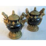 A pair of lidded urns, surmounted by classical ladies from the Regency Fine Arts collection.