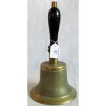 A brass hand bell.