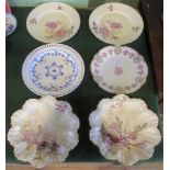 A pair of Limoges plates, with floral and bird decoration,