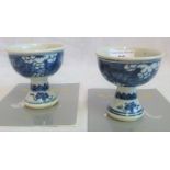 A near matching pair of Chinese blue & white stem cups, together with certificates.