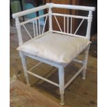 A contemporary white painted corner chair.