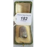 A cased hallmarked French thimble.