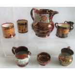 A large Staffordshire copper lustre ware jug together with seven further pieces of copper lustre
