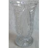 A large cut glass vase.