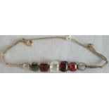 A seven stone gem set line bracelet, the vari-cut stones including: white sapphire,