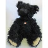 A black Steiff bear.