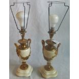 A pair of marble and gilt metal table lamps.