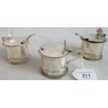 A set of three early 19th lidded mustard pots, together with three associated spoons.