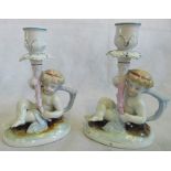 A pair of 19th century Conta & Boehme porcelain figural candlesticks.