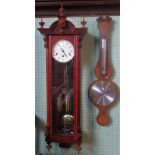 A reproduction mahogany Vienna wall clock, together with a reproduction aneroid banjo barometer.