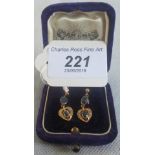A cased pair of sapphire and seed pearl pendant earrings with collet-set oval sapphires,