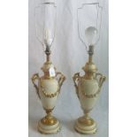 A large pair of marble and gilt metal table lamps.