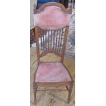 An oak framed Arts & Crafts hall chair, with pink draylon upholstery.