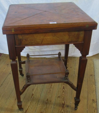 An Edwardian walnut envelope card table,