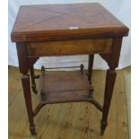 An Edwardian walnut envelope card table,